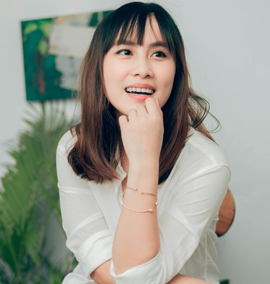 Photo by Pj Go woman in white long sleeve shirt